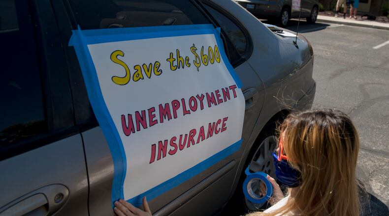 The emergency payments of $600 a week to jobless worker were credited with keeping households and consumer spending afloat. But the payments ended in July. Georgia officials say they plan to start paying half that amount as part of a program using money from the budget of the Federal Emergency Management Agency. (Bridget Bennett/AFP via Getty Images/TNS)