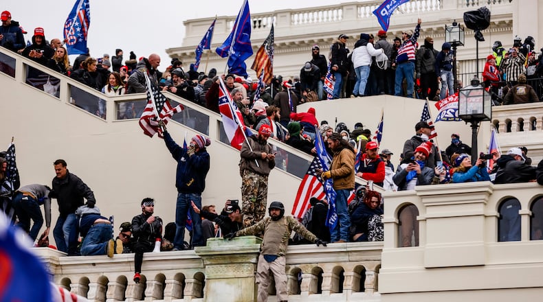 A pro-Donald Trump mob storms the U.S. Capitol following a rally with the then-president on Jan. 6 in Washington. (Samuel Corum/Getty Images/TNS)