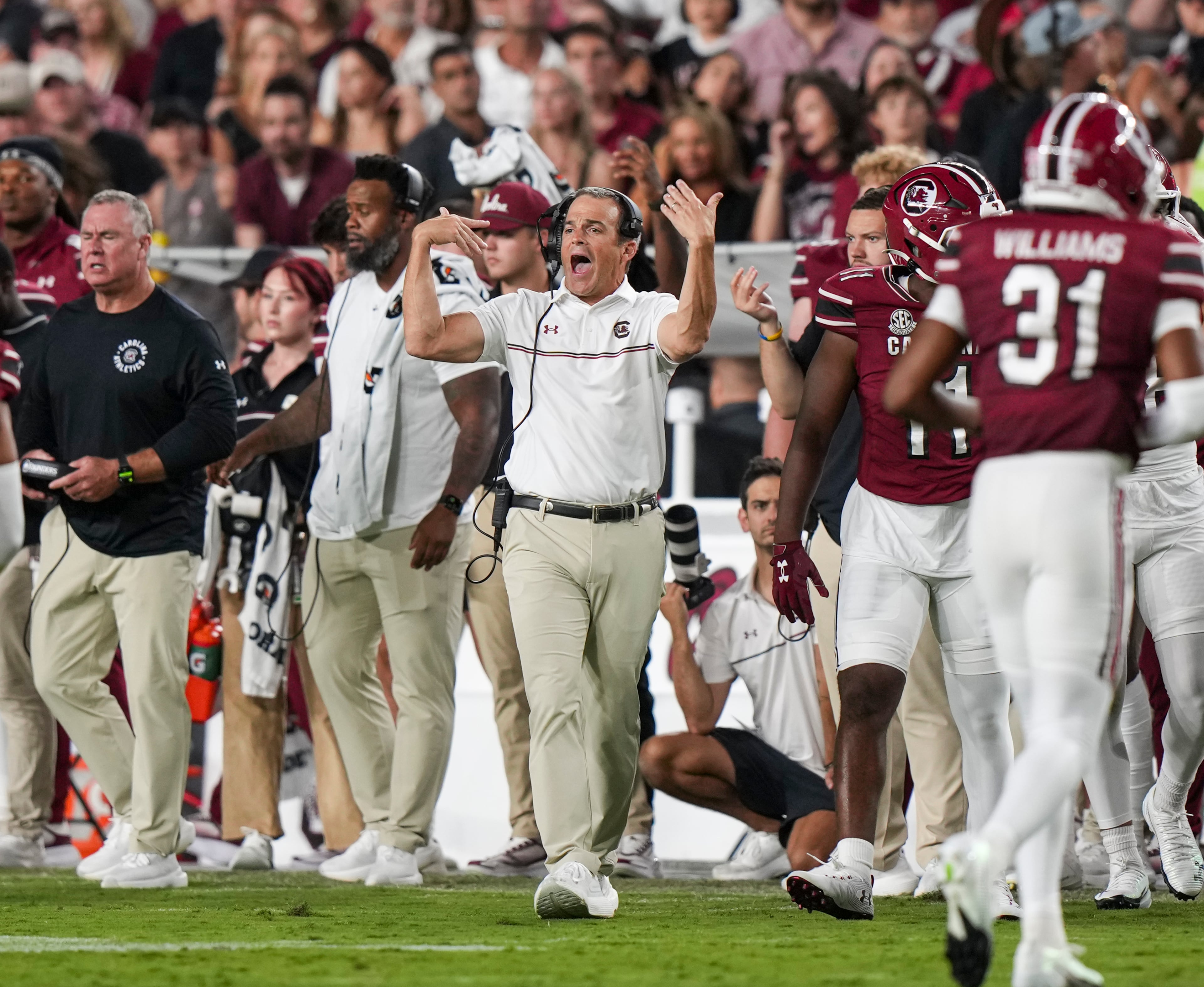South Carolina head coach Shane Beamer (center) summons his team during the second half against Vanderbilt on Saturday, Sept. 13, 2025, in Columbia, S.C. Beamer is 16-18 in SEC games, which roughly translates to 24-10 in the ACC. (David Yeazell/AP)