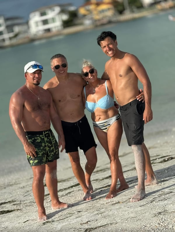 Mike Moczarski (from left), brother Paul, mother Joanna and brother Mark are seen at the beach. (Family photo)
