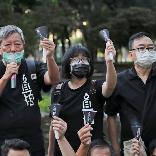 FILE - Fom left, pro-democracy activists Lee Cheuk-yan, Chow Hang-tung, and Cheung Man-kwong attend a gathering to mourn for those killed in the 1989 Tiananmen crackdown at Victoria Park, in Hong Kong on June 4, 2020. (AP Photo/Kin Cheung, File)