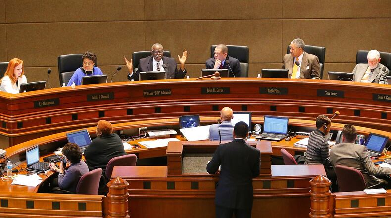 Fulton County Commission members Liz Havsmann (from Left), Emma Darnell, William Edwards, Chair John Eaves, Robb Pitts, Tom Lowe, and Joan Garner listen to debate in the Assembly Hall during the commission meeting on Wednesday, March 5, 2014, in Atlanta. CURTIS COMPTON / CCOMPTON@AJC.COM