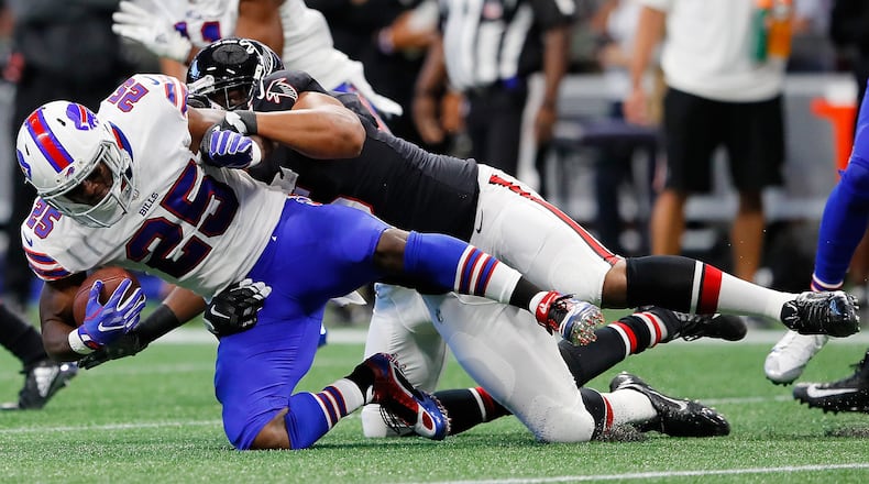 ATLANTA, GA - OCTOBER 01: LeSean McCoy #25 of the Buffalo Bills is tackled by Jack Crawford #95 of the Atlanta Falcons during the first half at Mercedes-Benz Stadium on October 1, 2017 in Atlanta, Georgia. (Photo by Kevin C. Cox/Getty Images)