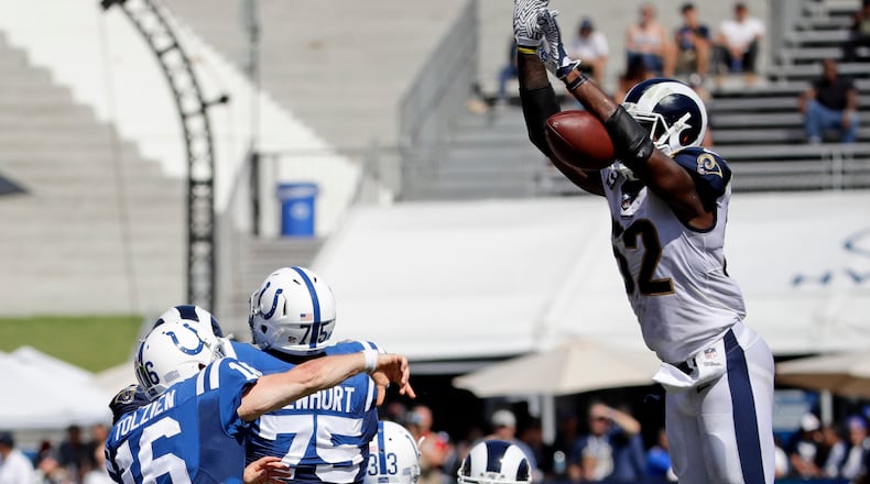 Los Angeles Rams middle linebacker Alec Ogletree, right, blocks a pass by Indianapolis Colts quarterback Scott Tolzien during the second half of an NFL football game Sunday, Sept. 10, 2017, in Los Angeles. (AP Photo/Alex Gallardo)