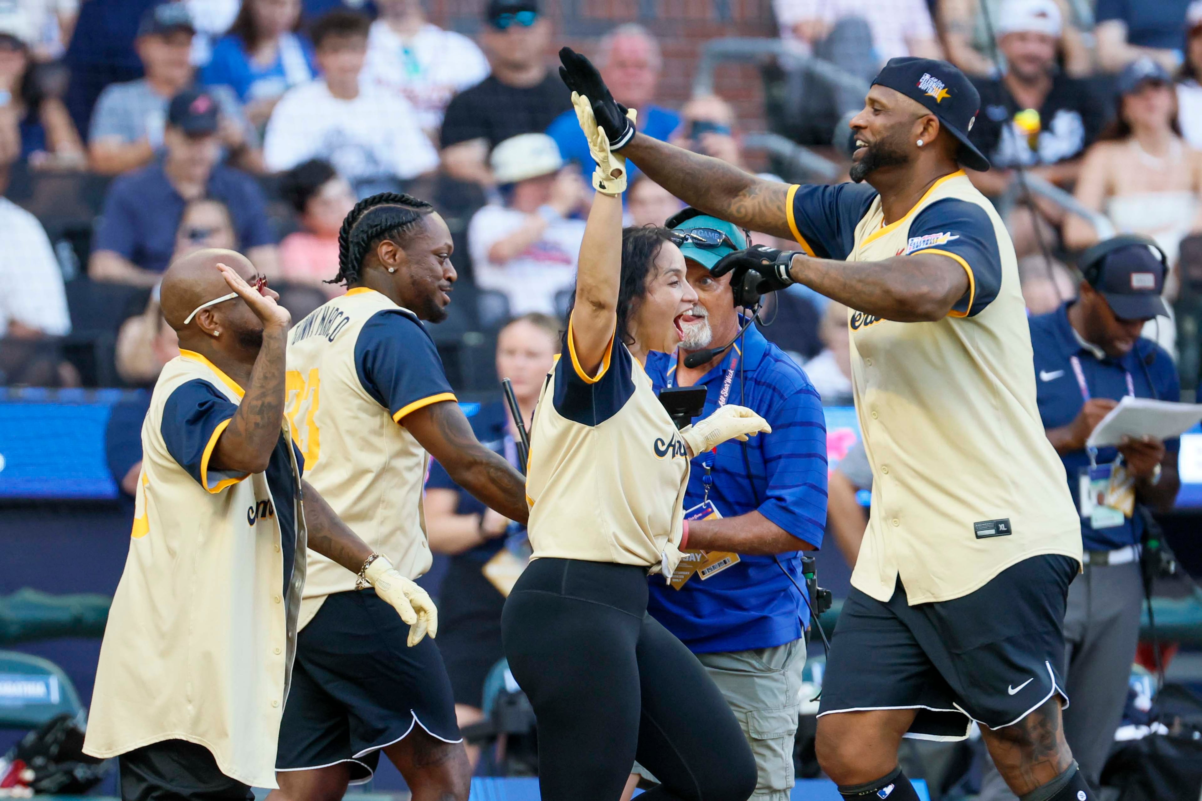 American League celebrities celebrate with CC Sabathia, a Yankees Legend & Hall of Famer, after his home run during the MLB All-Star Celebrity Game at Truist Park on Saturday, July 12, 2025, in Atlanta.
(Miguel Martinez/ AJC)