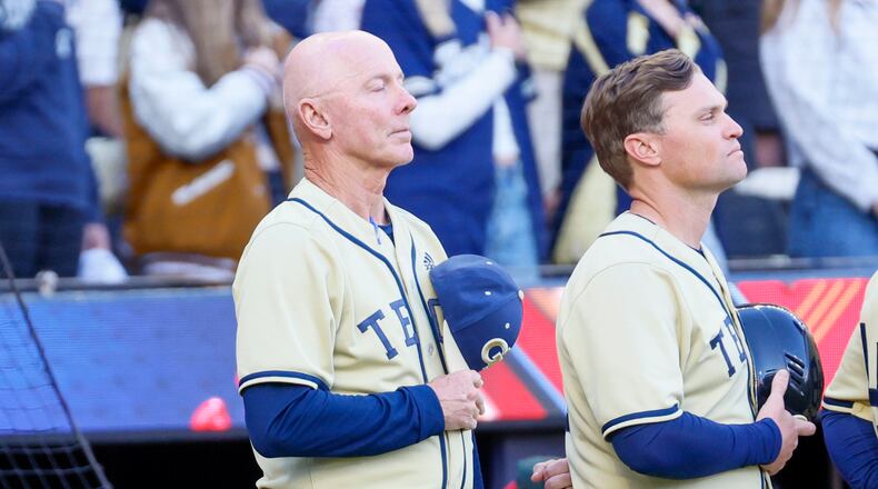 Georgia Tech Head Coach Danny Hall listens to the national anthem as his team prepares to face the Georgia Bulldogs on April 15, 2025, at Truist Park in Atlanta.
(Miguel Martinez/AJC)