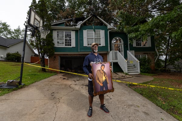Melvin Wanniplayor was able to retrieve Michael Jackson artwork from his home the day after the May 21 fire. (Arvin Temkar/AJC)
