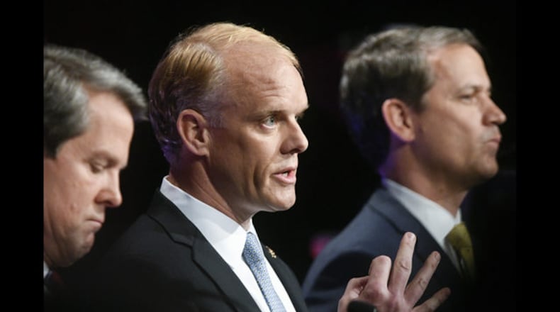 Georgia Republican gubernatorial candidates Casey Cagle, from left to right, listens to a rebuttal from Hunter Hill, as Brian Kemp, Clay Tippins, and Michael Williams look on during a debate, Thursday, May 17, 2018, in Atlanta. (AP Photo/John Amis)