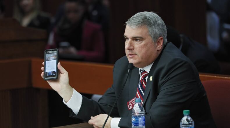 State Rep. John Carson, R-Marietta, presents House Bill 113 on Monday. The bill would raise fines for distracted driving citations. Some lawmakers were skeptical. Bob Andres / bandres@ajc.com