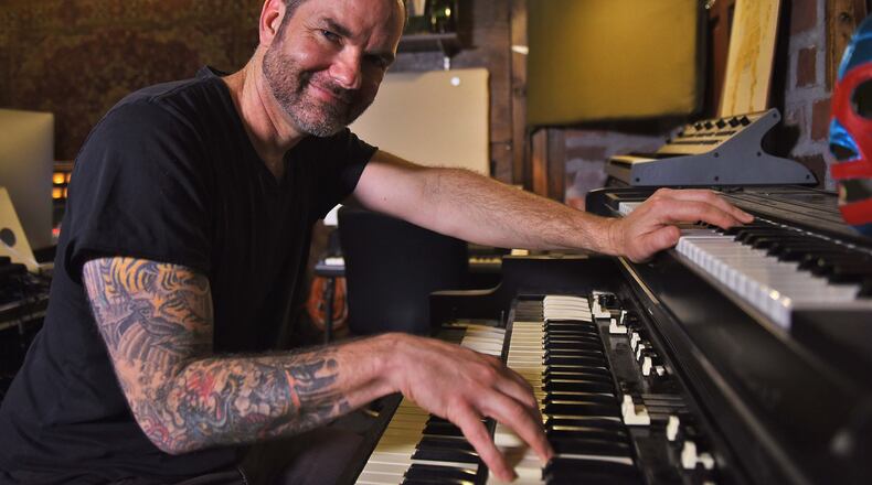 Brandon Bush, brother of Sugarland's Kristian, poses for a portrait inside his Decatur studio he shares with his brother. Brandon is a hugely talented and prolific musician and producer in his own right, who has played with Train, Sugarland, Little Big Town and John Mayer, composed works for Turner Classic Movies, films TV and gaming. Ryon Horne/RHORNE@AJC.COM