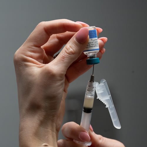 FILE - Lauren Ellenburg, a nurse, prepares a combination measles, mumps and rubella vaccine for a patient at Tiger Pediatrics in Easley, S.C., March 17, 2026. (AP Photo/Mary Conlon, File)