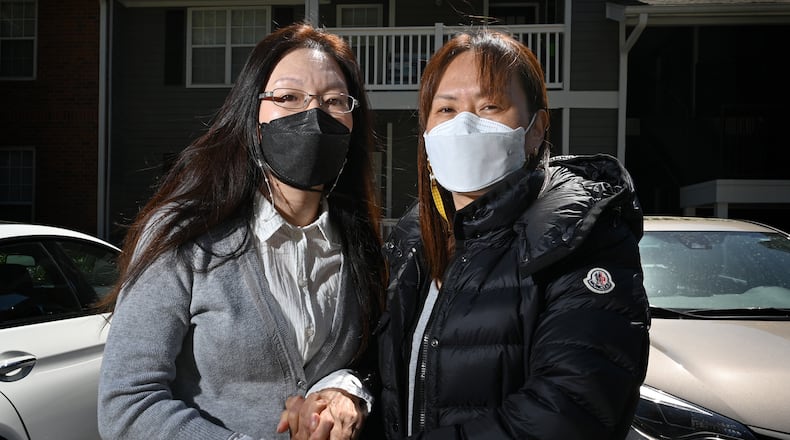 Hyo Jung Kim, 46, (left) and Hyun Jung Kim, 48, are the daughters of the late Soon Chung Park, one of the Atlanta spa shooting victims. Their mother’s apartment unit is shown in background in Duluth on Friday, April 2, 2021. Soon Chung Park was among eight people shot and killed March 16 at three spas — two in Atlanta and one in Cherokee County. Park was one of six female victims of Asian heritage. (Hyosub Shin / Hyosub.Shin@ajc.com)