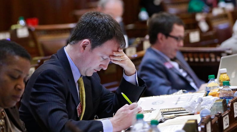 Rep. Bob Trammell, D-Luthersville, follows along with the numerous bills that came up for a vote. on crossover day at the Capitol on Feb. 29, 2016. BOB ANDRES / BANDRES@AJC.COM