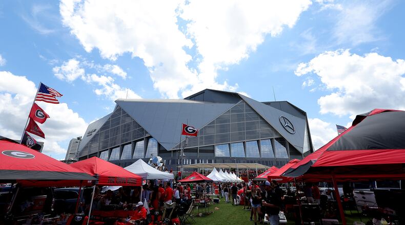 Fans are seen tailgating prior to the Chick-fil-A Kick-Off Game between Oregon and Georgia at Mercedes-Benz Stadium on Sept. 3, 2022, in Atlanta. (Kevin C. Cox/Getty Images/TNS)