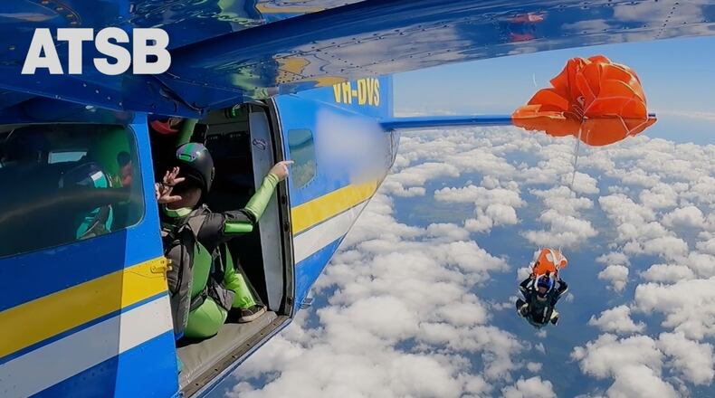 In this image taken from a video a skydiver is caught on the wing of a plane as he exited the aircraft in Tully, North Queensland, Sept.20, 2025.(Jarrad Nolan/Australian Transport Safety Bureau via AP)