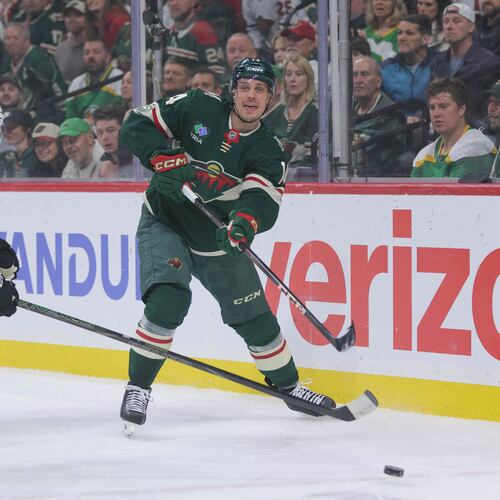 Minnesota Wild center Joel Eriksson Ek (14) passes while Dallas Stars defenseman Lian Bichsel (6) defends during the first period of Game 6 in the first round of the NHL hockey Stanley Cup playoff series Thursday, April 30, 2026, in St. Paul, Minn. (AP Photo/Bailey Hillesheim)
