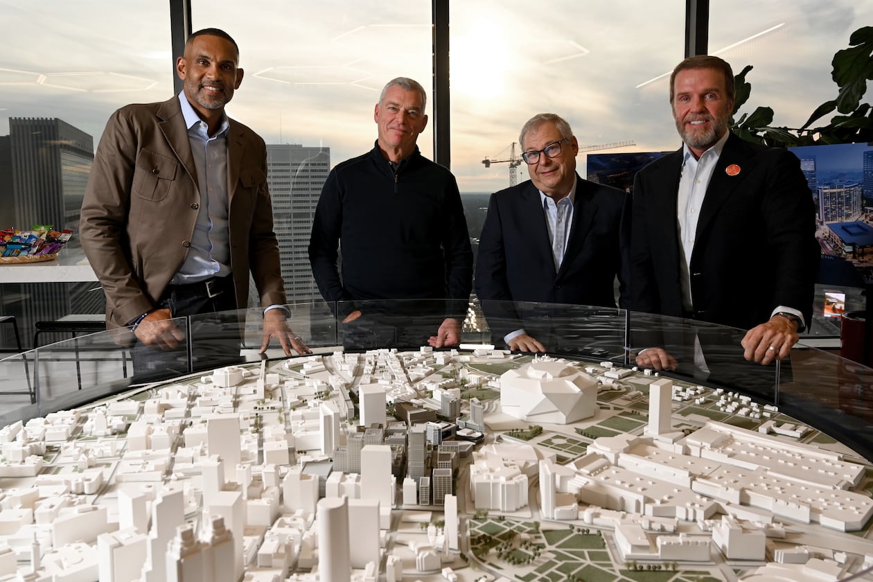 Heads of the Centennial Yards project, from left, Grant Hill, NBA Hall of Famer and co-owner of the Atlanta Hawks; Tony Ressler, principal owner of the Hawks; Hawks CEO Steve Koonin and Centennial Yards President Brian McGowan pose for a group photo at the Centennial Yards Company offices on Wednesday, December 3, 2025, in Atlanta. (Hyosub Shin / AJC)