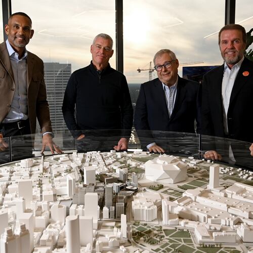 Heads of the Centennial Yards project, from left, Grant Hill, NBA Hall of Famer and co-owner of the Atlanta Hawks; Tony Ressler, principal owner of the Hawks; Hawks CEO Steve Koonin and Centennial Yards President Brian McGowan pose for a group photo at the Centennial Yards Company offices on Wednesday, December 3, 2025, in Atlanta. (Hyosub Shin / AJC)