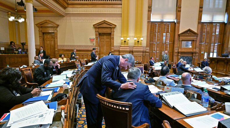 February 24, 2022 Atlanta - Sen. Marty Harbin (R-Tyrone), standing, confers with Sen. John Kennedy (R-Macon) after he introduced SB-435 in the Senate Chambers at the Georgia State Capitol on Thursday, February 24, 2022. Senate Bill 435 would ban schools from allowing transgender girls from participating in sports that align with their gender identity. SB-435 passed in the Senate Chambers. (Hyosub Shin / Hyosub.Shin@ajc.com)