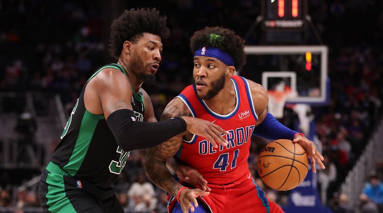 The Detroit Pistons' Saddiq Bey (41) works against the Boston Celtics' Marcus Smart (36) during the first half at Little Caesars Arena on Saturday, Feb. 26, 2022, in Detroit. (Gregory Shamus/Getty Images/TNS)