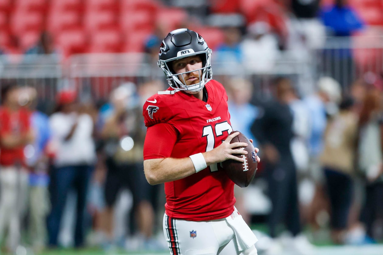 Atlanta Falcons quarterback Cooper Rush runs with the ball during warm-ups before the game against the Carolina Panthers at Mercedes-Benz Stadium in Atlanta on Sunday, Sept. 20, 2026. (Miguel Martinez/AJC)