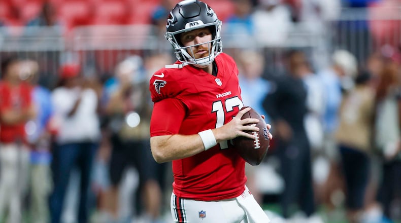 Atlanta Falcons quarterback Cooper Rush runs with the ball during warm-ups before the game against the Carolina Panthers at Mercedes-Benz Stadium in Atlanta on Sunday, Sept. 20, 2026. (Miguel Martinez/AJC)