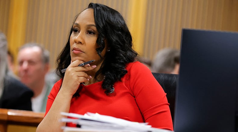 Fulton County District Attorney Fani Willis listens during the final arguments in her disqualification hearing at the Fulton County Courthouse on March 1, 2024, in Atlanta, Georgia. (Alex Slitz/Pool/AFP via Getty Images/TNS)
