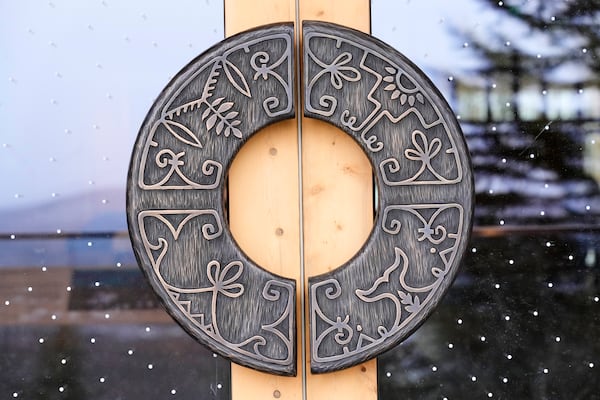 Wabanaki artistry is seen on the on door handles at the Tekakapimək Contact Station, Jan. 7, 2025, at the Katahdin Woods and Waters Monument in northern Maine. (AP Photo/Robert F. Bukaty)