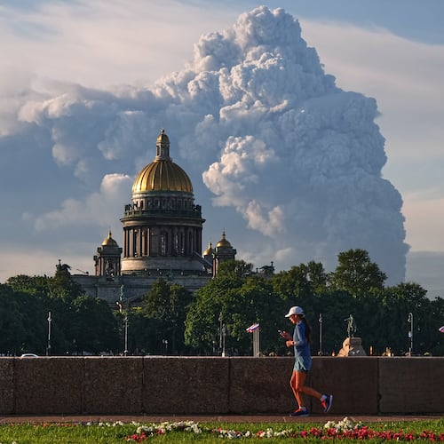 Smoke billows into the sky following Ukrainian drone strikes on warehouses of Russia's online retailer Wildberries, in St. Petersburg, Russia, Friday, July 24, 2026, with St. Isaac's Cathedral seen in foreground. (UGC via AP)