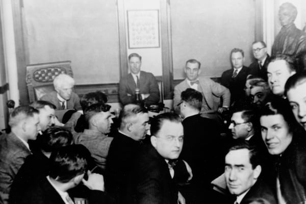 FILE - This 1921 file photo shows Judge Kenesaw Mountain Landis, rear left, as Chicago White Sox players, Charles "Swede" Risberg, center left, and Arnold "Chick" Gandil, look on during the investigation of the infamous "Black Sox" scandal in Chicago. (AP Photo/File)