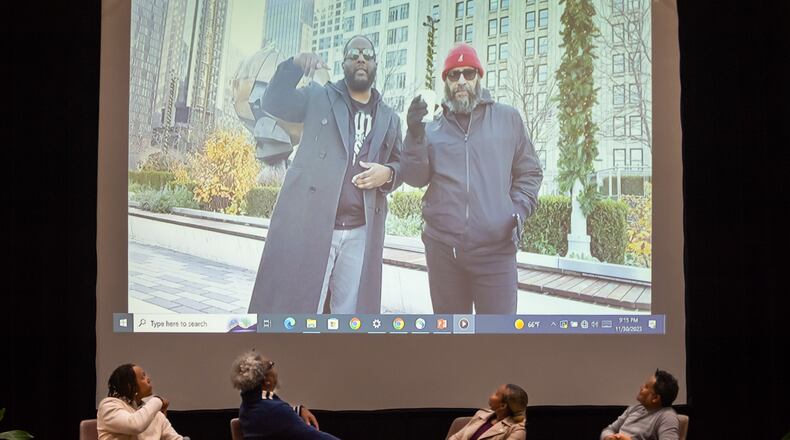 On screen, the AJC’s Ryon Horne (left) and Tyson Horne deliver a prerecorded message to viewers following a screening of their film, the AJC's hip-hop documentary "The South Got Something to Say,” at the Atlanta University Center Robert W. Woodruff Library on Thursday, Nov. 30, 2023. The panel onstage is the Maroon Tiger's Auzzy Byrdsell (from left) and AJC staffers Ernie Suggs, DeAsia Paige and Mike Jordan.
Bita Honarvar for The Atlanta Journal-Constitution