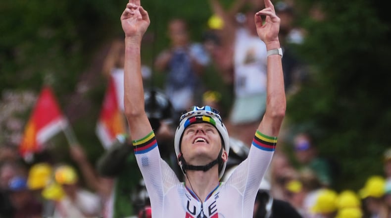 Slovenia's Tadej Pogacar celebrates as he crosses the finish line to win the sixth stage of the Tour de France cycling race with start in Pau and finish in Gavarnie-Gedre, France, Thursday, July 9, 2026. (AP Photo/Thibault Camus)