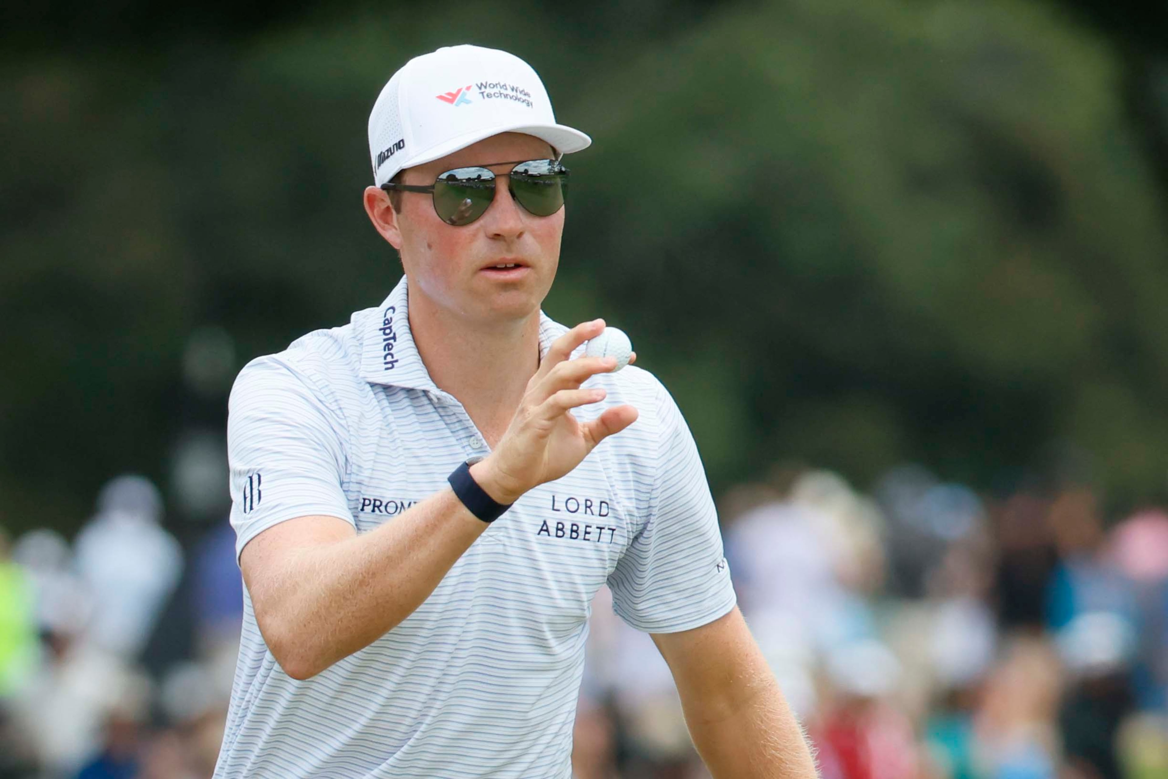 Ben Griffin signals to the crowd after his putt on the third hole during the final round of the PGA Tour Championship at East Lake Golf Club on Sunday, Aug. 24, 2025, in Atlanta. (Miguel Martinez/ AJC)