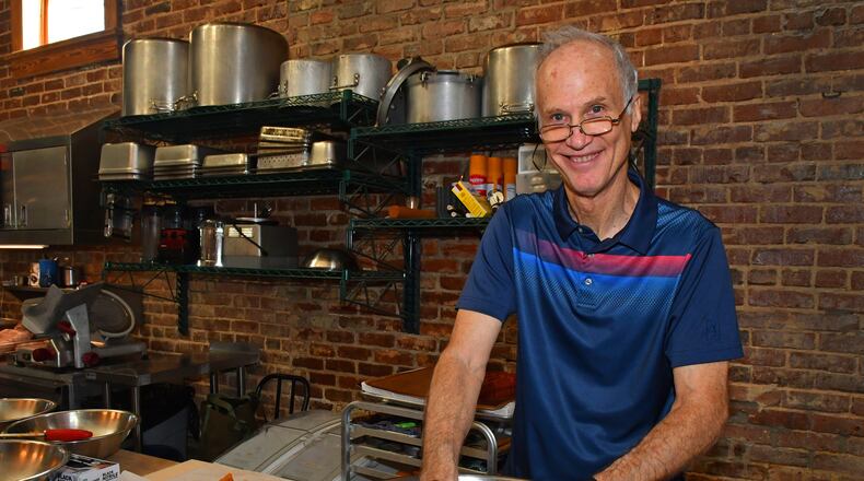 While volunteering at Staplehouse, Mike Smith strains sweet potatoes using a tamis and plastic paddle. The East Cobb resident has volunteered in close to 30 Atlanta restaurants because he loves learning food preparatio.. Chris Hunt for The Atlanta Journal-Constitution
