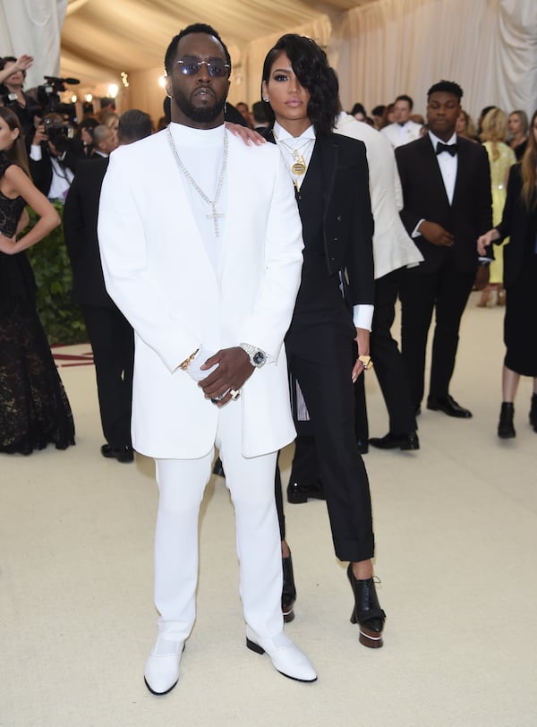 Sean "Diddy" Combs, left, and Cassie Ventura attend The Metropolitan Museum of Art's Costume Institute benefit gala celebrating the opening of the Heavenly Bodies: Fashion and the Catholic Imagination exhibition, May 7, 2018, in New York. (Photo by Evan Agostini/Invision/AP File)