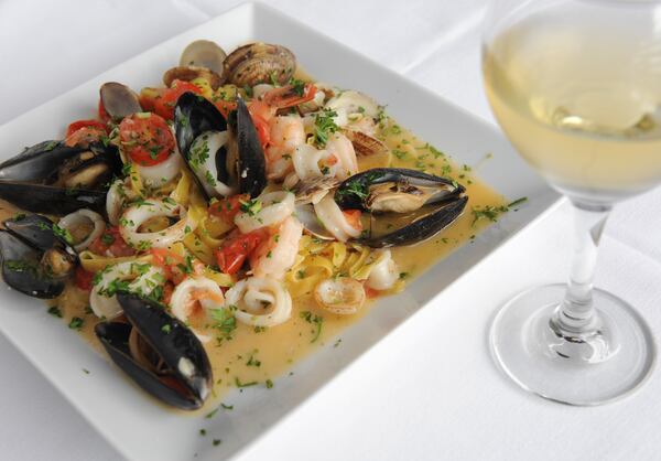 Fettuccine all Pescatora- fresh fettuccine, little neck clams, calamari, shrimps, mussels in white wine sauce. (or red) (BECKY STEIN PHOTOGRAPHY)