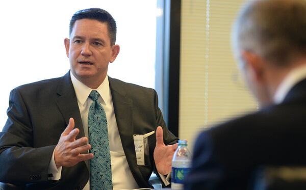 Bobby Cagle, the former head of the state Division of Family and Child Services, is now an executive with CareSource, one of the state’s Medicaid health plans. (Kent D. Johnson/AJC)