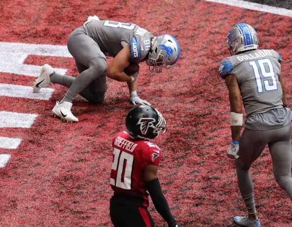 Falcons cornerback Kendall Sheffield reacts as Detroit Lions tight end T.J. Hockenson (left) scores a touchdown as time expires Sunday, Oct. 25, 2020, at Mercedes-Benz Stadium in Atlanta. (Curtis Compton / Curtis.Compton@ajc.com)