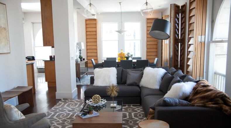 Deep charcoal mixed with faux fur and chocolate accents creates a warm and inviting living space. (Handout/TNS)