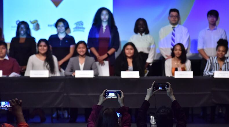 Selected students pose for a group photograph after they signed with their 8-week internship sponsors during a “Signing Day” at Central Gwinnett High School in Lawrenceville on Tuesday, April 30, 2019. HYOSUB SHIN / HSHIN@AJC.COM
