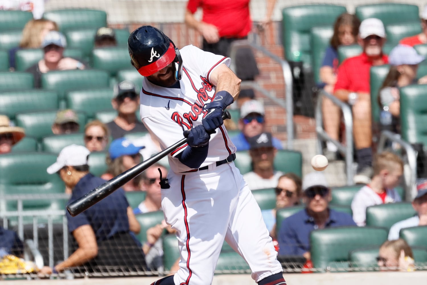 Braves shortstop Dansby Swanson connects during the sixth inning against the Phillies on Sunday at Truist Park. (Miguel Martinez / miguel.martinezjimenez@ajc.com)