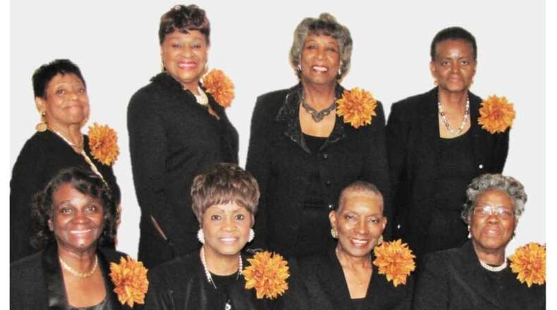 These eight women are members of the G.I.R.L.S. Bridge Club, which recently donated $100,000 to Spelman College to start a scholarship endowment for students, particularly those considering careers as teachers. (Courtesy of the G.I.R.L.S. Bridge Club)