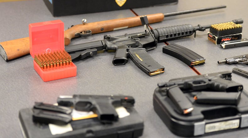 Guns confiscated by the DeKalb County State Court Probation Department from owners convicted of misdemeanor domestic violence. KENT D. JOHNSON/ kdjohnson@ajc.com
