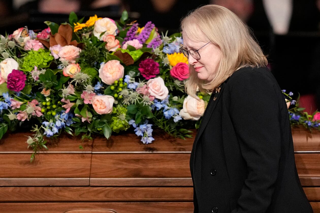 Amy Carter walks past the casket of her mother, former first lady Rosalynn Carter, after speaking at a tribute service for her mother at Glenn Memorial Church at Emory University on Tuesday, Nov. 28, 2023, in Atlanta. (Brynn Anderson/Pool/AFP/Getty Images/TNS)