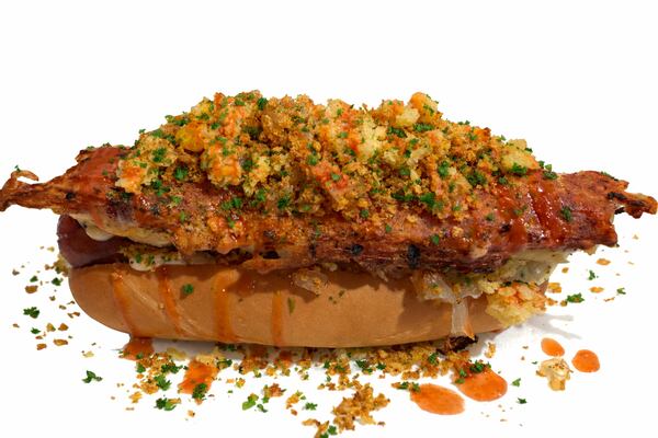 Head to Pepper's Hotdogs during Black Restaurant Week for their special hot dog, the Sunday Supper, with mac and cheese, caramelized onions, garlic aioli, fried chicken crumbs, cornbread and hot honey. (Courtesy of Tarina Hodges)
