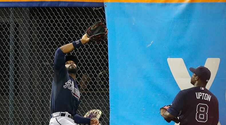 Atlanta Braves center fielder Jason Heyward (22) hauls in David Wright's third inning flyout in a baseball game against the New York Mets, Monday, July 22, 2013, in New York. (AP Photo/Kathy Willens)