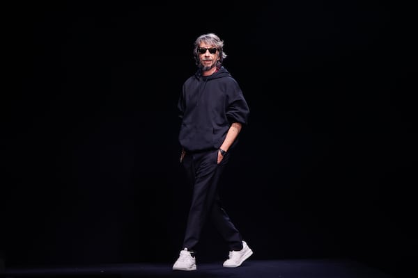 FILE - Designer Pierpaolo Piccioli accepts applause at the end of the Valentino Haute Couture Spring-Summer 2023 collection presented in Paris, Wednesday, Jan. 25, 2023. (AP Photo/Lewis Joly, File)