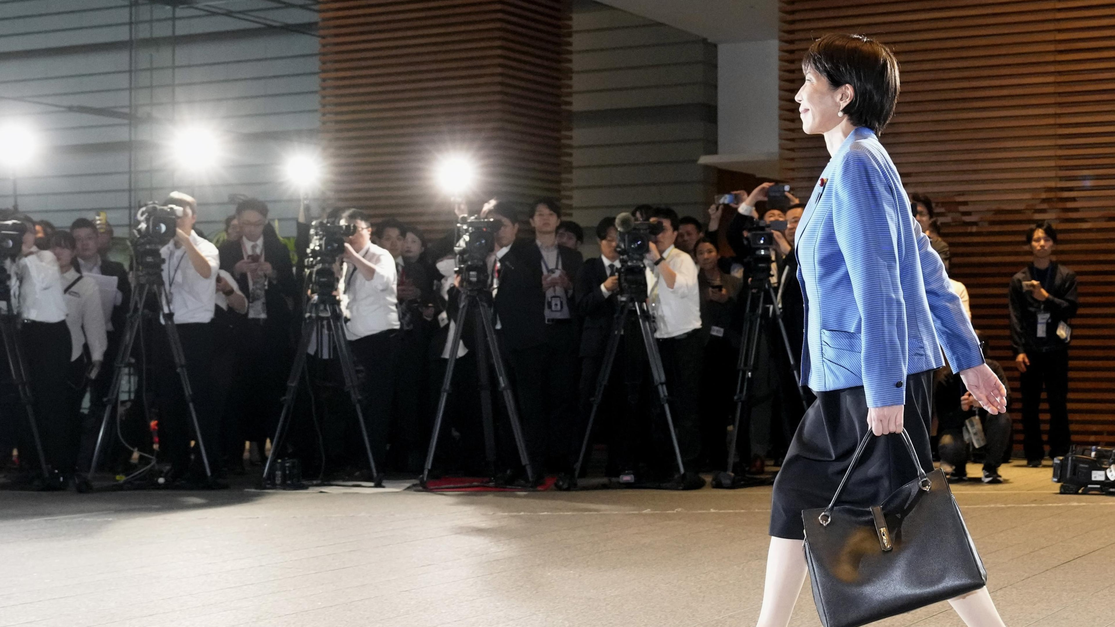 Japanese Prime Minister Sanae Takaichi arrives at the prime minister's office in Tokyo on Oct. 21, 2025. (Kyodo News via AP)