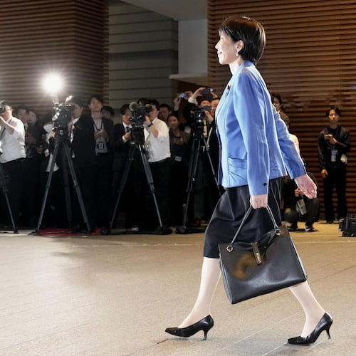 Japanese Prime Minister Sanae Takaichi arrives at the prime minister's office in Tokyo on Oct. 21, 2025. (Kyodo News via AP)
