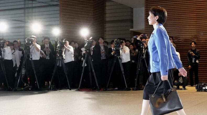 Japanese Prime Minister Sanae Takaichi arrives at the prime minister's office in Tokyo on Oct. 21, 2025. (Kyodo News via AP)